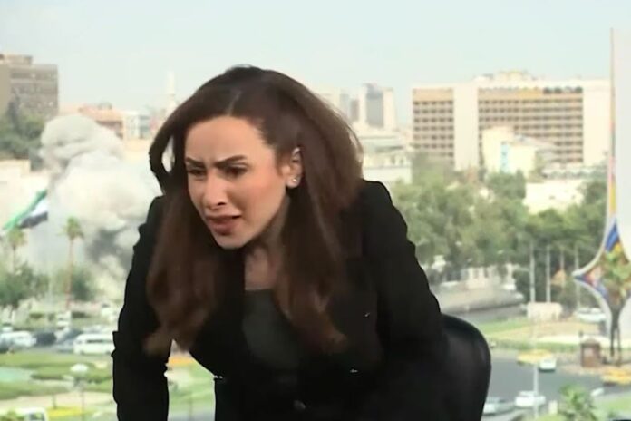 সিরিয়ায় টিভি ভবনে হামলা, দৌড়ে পালালেন উপস্থাপিকা