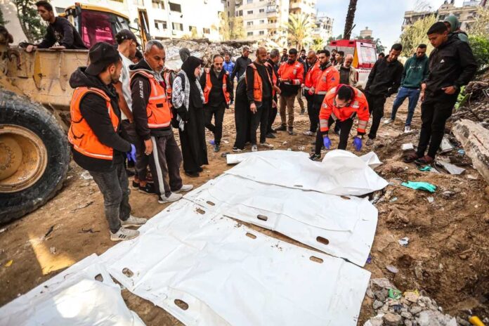 1765949108-079023a9749cc419f95b887ac2b3e3f8 গাজায় ধ্বংসস্তূপে মিলল একই পরিবারের ৩০ জনের মরদেহ