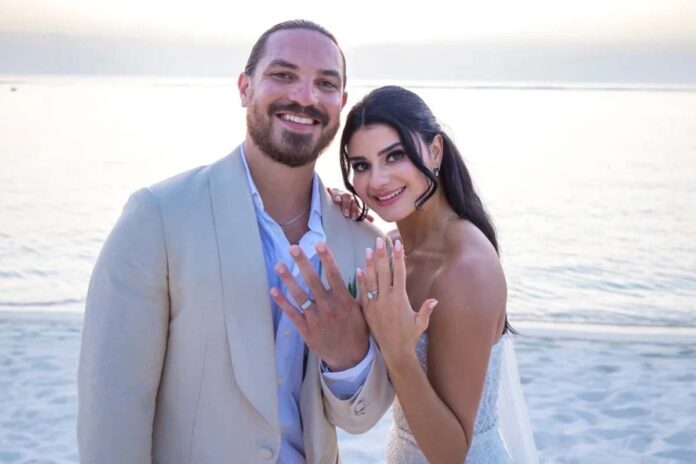 1773520390-0d40bb7ae83f974d558d659c20876c94 ইরান যুদ্ধ কীভাবে বদলে দিল এক দম্পতির বিয়ের আনন্দ