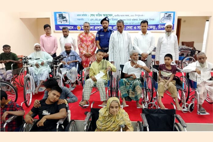 চাঁদপুরে প্রধানমন্ত্রীর ত্রাণ ও কল্যাণ তহবিলের সাত লাখ টাকা ও হুইল চেয়ার বিতরণ
